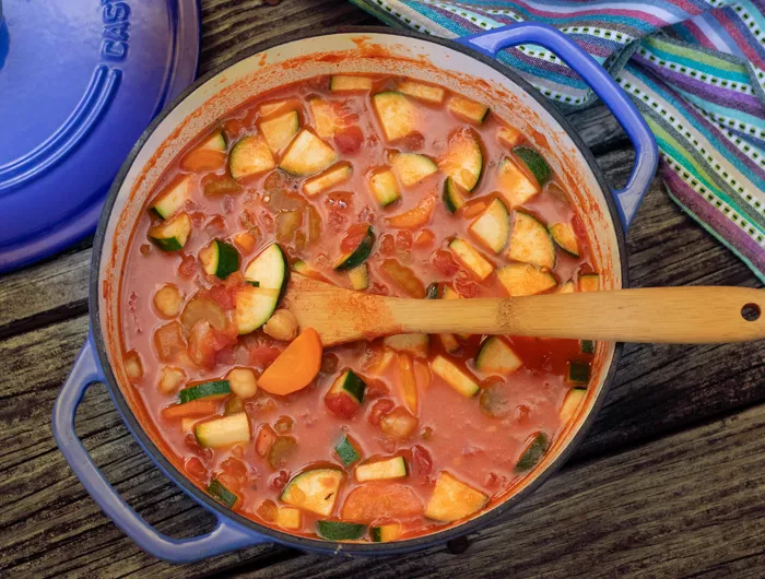 over head shot of large pot filled with minsestrone stew