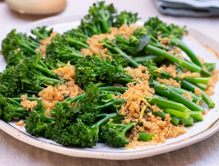 plate with broccolini sprinkled with parmesan crumbs