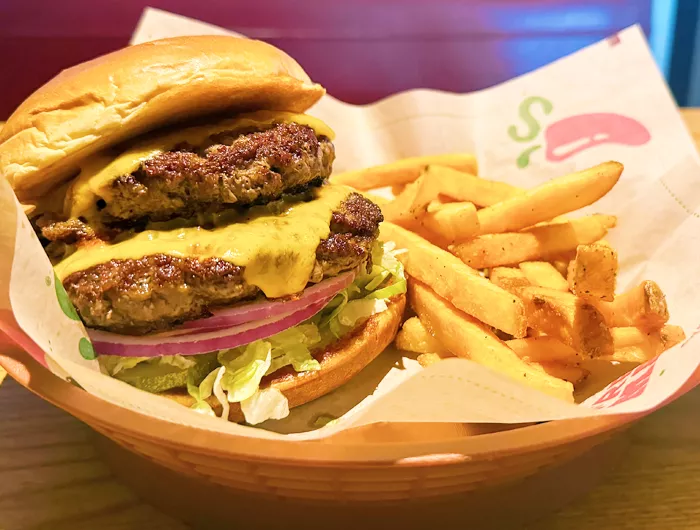 Chilis Double OldTimer with cheese on plate with fries