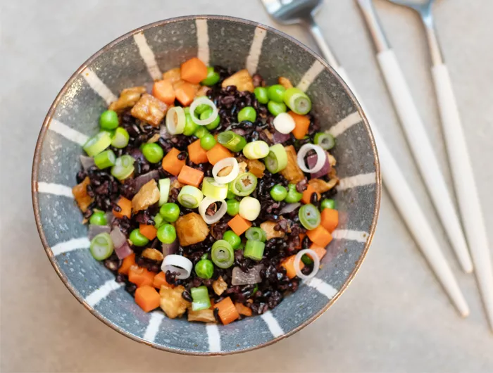 bowl filled with black rice and chopped veggies