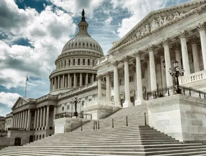 Stark cloudy weather over empty exterior view of the US Capitol Building in Washington DC, USA