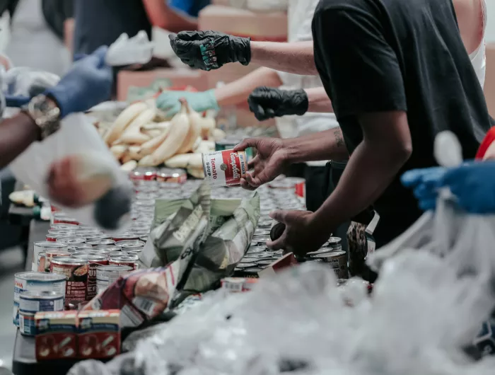 People volunteering at a food pantry