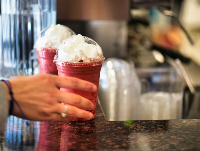 Berry frappe drink with whipped cream