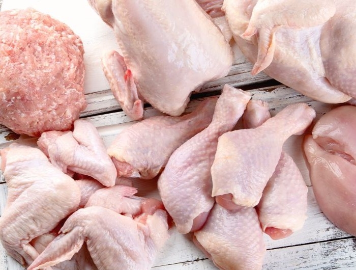 Raw chicken and poultry on a cutting board