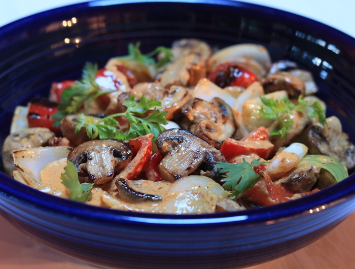 blue bowl with mushrooms and other veggies mixed 