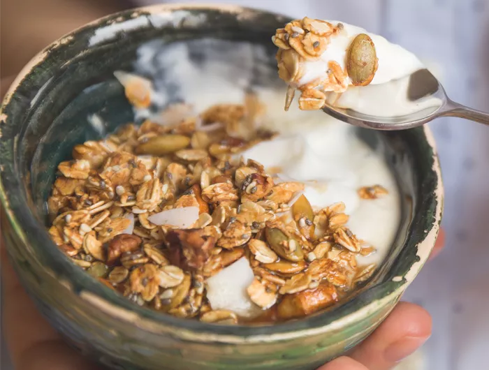 bowl of cereal and milk and yogurt