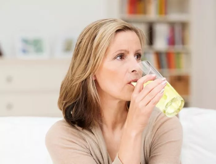 woman drinking beverage