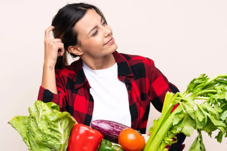 a woman with fresh produce