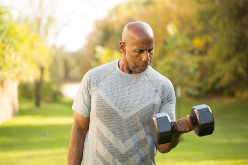 man lifting weights