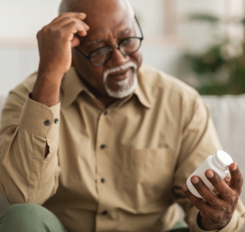 man holding pills