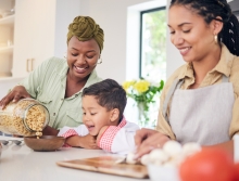 a happy family having cereal for breakfast